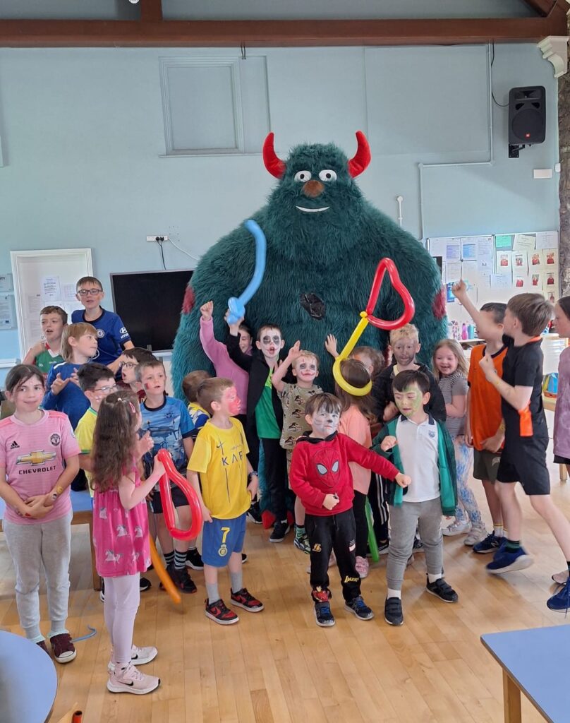 The big friendly monster meets the kids.